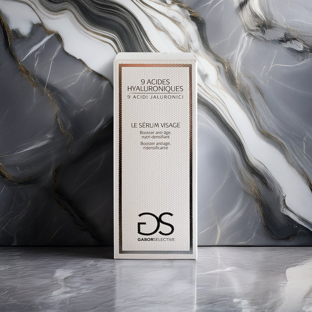 foto del siero viso su sfondo grigio con venature bianche e dorate